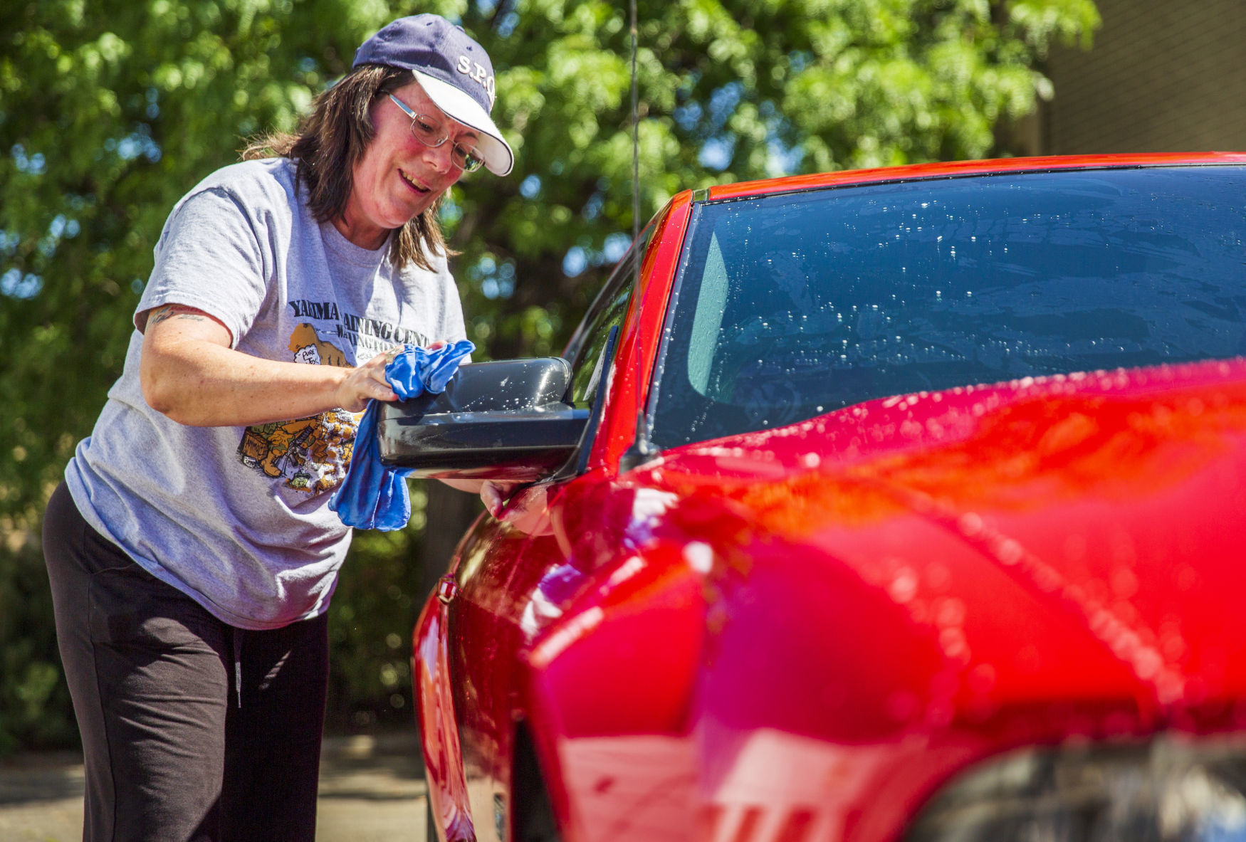 Julie washes her Mustang